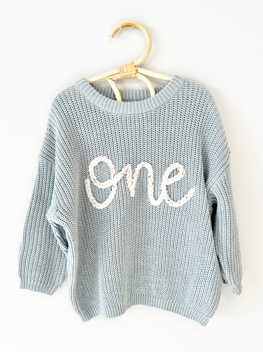 "ONE" EMBROIDERED SWEATER